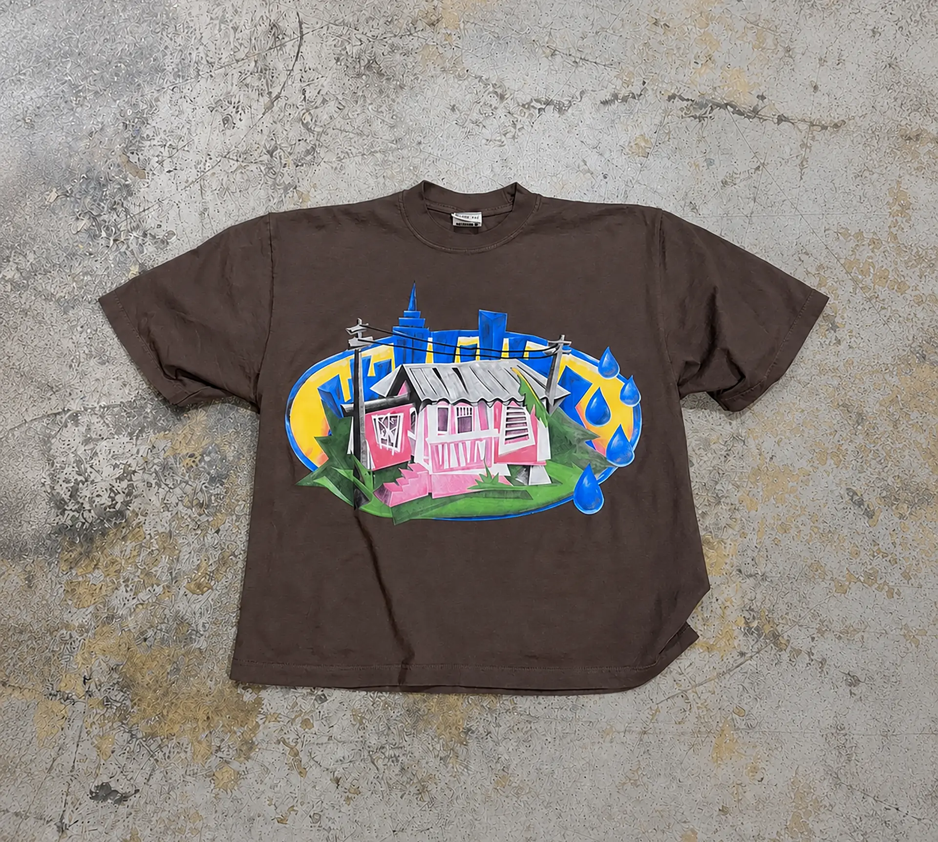 Airbrush-style multi-color print on brown boxy tee